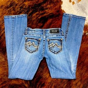 Miss Me Low Rise Boot Cut Distressed Jeans